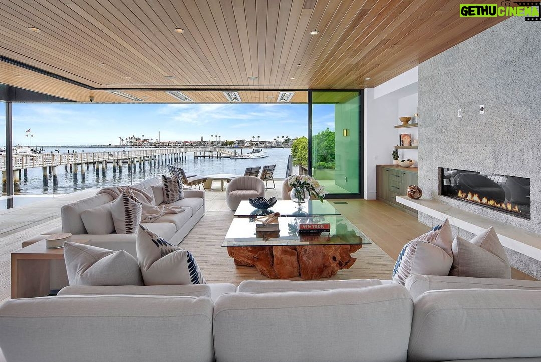 Jason Oppenheim - 53.2K Likes - Just Listed - 2201 Bayside Dr. - $27,995,000
5 Beds / 9 Baths / 9,129 Sq. Ft. / 11,921 Lot Size
This newly constructed custom estate offers exclusive Corona Del Mar waterfront living with intricate design touches and a harmonious blend of natural stone and wood elements. Consisting of 5 ensuite bedrooms and 9 bathrooms and boasting approximately 50 feet of private beachfront, it caters to water enthusiasts and offers shared ownership of one of the longest private docks on the west coast, capable of accommodating multiple yachts up to 100ft in length. Upon arrival, you will be greeted by meticulously landscaped surroundings, a striking grand pivot door, and a double height foyer that sets the tone for the residence. Inside, the space boasts European wide plank bleached oak flooring by Gaetano, illuminated floating staircases, and expansive glass features that fill the approximately 9,129 square feet of interiors with an abundance of natural light. The property seamlessly connects to its surroundings through slide-away pocket doors that open onto a heated patio, a zero-edge saltwater pool and spa, and a courtyard featuring a built-in Lynx Grill. The kitchen features custom Honed Calcatta Vagli slab countertops and backsplash, a 55" La Canche designer stove imported from Paris, a butler's pantry, and stained white oak cabinetry. Convenience is paramount, with a Waupaca elevator servicing all four floors, including the lower level, which encompasses a media area, a dry bar, and temperature controlled wine room. Upstairs, the owner's suite presents a heated wraparound balcony with mesmerizing water views, a living space with a fireplace, and two spa-like bathrooms, each complemented by its own walk-in closet. The top level reveals a lounge area that opens onto a rooftop deck with grass and sweeping views of the Newport Beach Harbor offering limitless ocean-view entertaining. Equipped with cutting-edge technology, the property also includes a nearly 3,000 sq. ft., 6+ car garage with epoxy flooring.
Listed by
@briancharlesfurstenfeld
@mskaylacardona
@jasonoppenheim