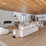 Jason Oppenheim Instagram - Just Listed - 2201 Bayside Dr. - $27,995,000 5 Beds / 9 Baths / 9,129 Sq. Ft. / 11,921 Lot Size This newly constructed custom estate offers exclusive Corona Del Mar waterfront living with intricate design touches and a harmonious blend of natural stone and wood elements. Consisting of 5 ensuite bedrooms and 9 bathrooms and boasting approximately 50 feet of private beachfront, it caters to water enthusiasts and offers shared ownership of one of the longest private docks on the west coast, capable of accommodating multiple yachts up to 100ft in length. Upon arrival, you will be greeted by meticulously landscaped surroundings, a striking grand pivot door, and a double height foyer that sets the tone for the residence. Inside, the space boasts European wide plank bleached oak flooring by Gaetano, illuminated floating staircases, and expansive glass features that fill the approximately 9,129 square feet of interiors with an abundance of natural light. The property seamlessly connects to its surroundings through slide-away pocket doors that open onto a heated patio, a zero-edge saltwater pool and spa, and a courtyard featuring a built-in Lynx Grill. The kitchen features custom Honed Calcatta Vagli slab countertops and backsplash, a 55" La Canche designer stove imported from Paris, a butler's pantry, and stained white oak cabinetry. Convenience is paramount, with a Waupaca elevator servicing all four floors, including the lower level, which encompasses a media area, a dry bar, and temperature controlled wine room. Upstairs, the owner's suite presents a heated wraparound balcony with mesmerizing water views, a living space with a fireplace, and two spa-like bathrooms, each complemented by its own walk-in closet. The top level reveals a lounge area that opens onto a rooftop deck with grass and sweeping views of the Newport Beach Harbor offering limitless ocean-view entertaining. Equipped with cutting-edge technology, the property also includes a nearly 3,000 sq. ft., 6+ car garage with epoxy flooring. Listed by @briancharlesfurstenfeld @mskaylacardona @jasonoppenheim Corona del Mar