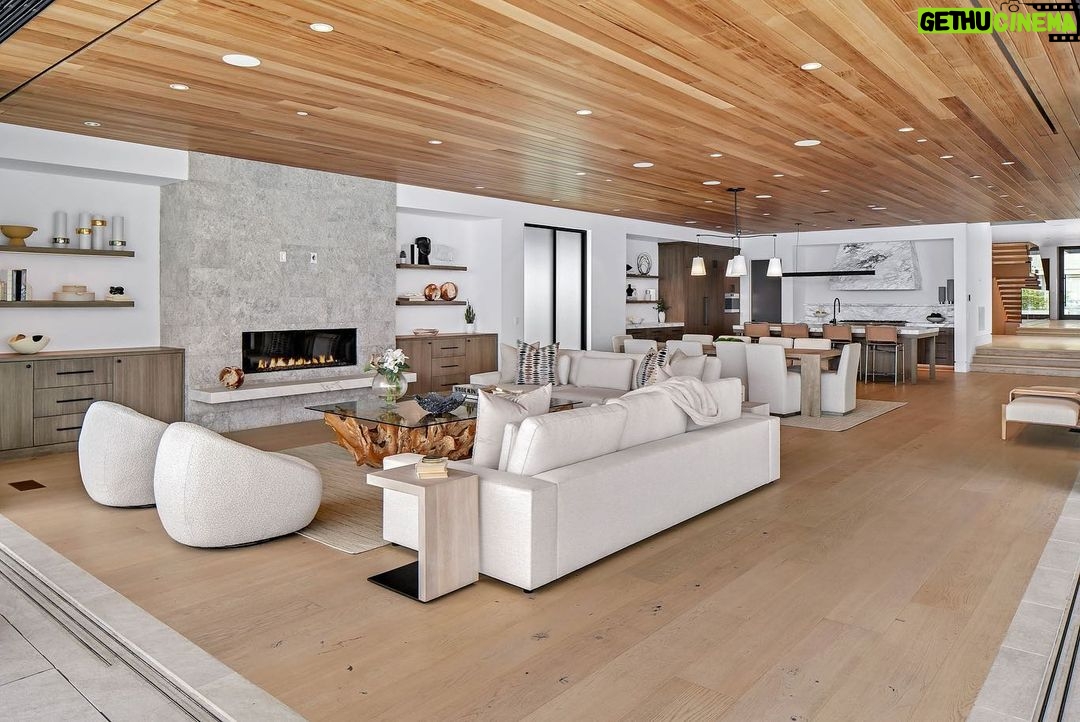 Jason Oppenheim - 53.2K Likes - Just Listed - 2201 Bayside Dr. - $27,995,000
5 Beds / 9 Baths / 9,129 Sq. Ft. / 11,921 Lot Size
This newly constructed custom estate offers exclusive Corona Del Mar waterfront living with intricate design touches and a harmonious blend of natural stone and wood elements. Consisting of 5 ensuite bedrooms and 9 bathrooms and boasting approximately 50 feet of private beachfront, it caters to water enthusiasts and offers shared ownership of one of the longest private docks on the west coast, capable of accommodating multiple yachts up to 100ft in length. Upon arrival, you will be greeted by meticulously landscaped surroundings, a striking grand pivot door, and a double height foyer that sets the tone for the residence. Inside, the space boasts European wide plank bleached oak flooring by Gaetano, illuminated floating staircases, and expansive glass features that fill the approximately 9,129 square feet of interiors with an abundance of natural light. The property seamlessly connects to its surroundings through slide-away pocket doors that open onto a heated patio, a zero-edge saltwater pool and spa, and a courtyard featuring a built-in Lynx Grill. The kitchen features custom Honed Calcatta Vagli slab countertops and backsplash, a 55" La Canche designer stove imported from Paris, a butler's pantry, and stained white oak cabinetry. Convenience is paramount, with a Waupaca elevator servicing all four floors, including the lower level, which encompasses a media area, a dry bar, and temperature controlled wine room. Upstairs, the owner's suite presents a heated wraparound balcony with mesmerizing water views, a living space with a fireplace, and two spa-like bathrooms, each complemented by its own walk-in closet. The top level reveals a lounge area that opens onto a rooftop deck with grass and sweeping views of the Newport Beach Harbor offering limitless ocean-view entertaining. Equipped with cutting-edge technology, the property also includes a nearly 3,000 sq. ft., 6+ car garage with epoxy flooring.
Listed by
@briancharlesfurstenfeld
@mskaylacardona
@jasonoppenheim