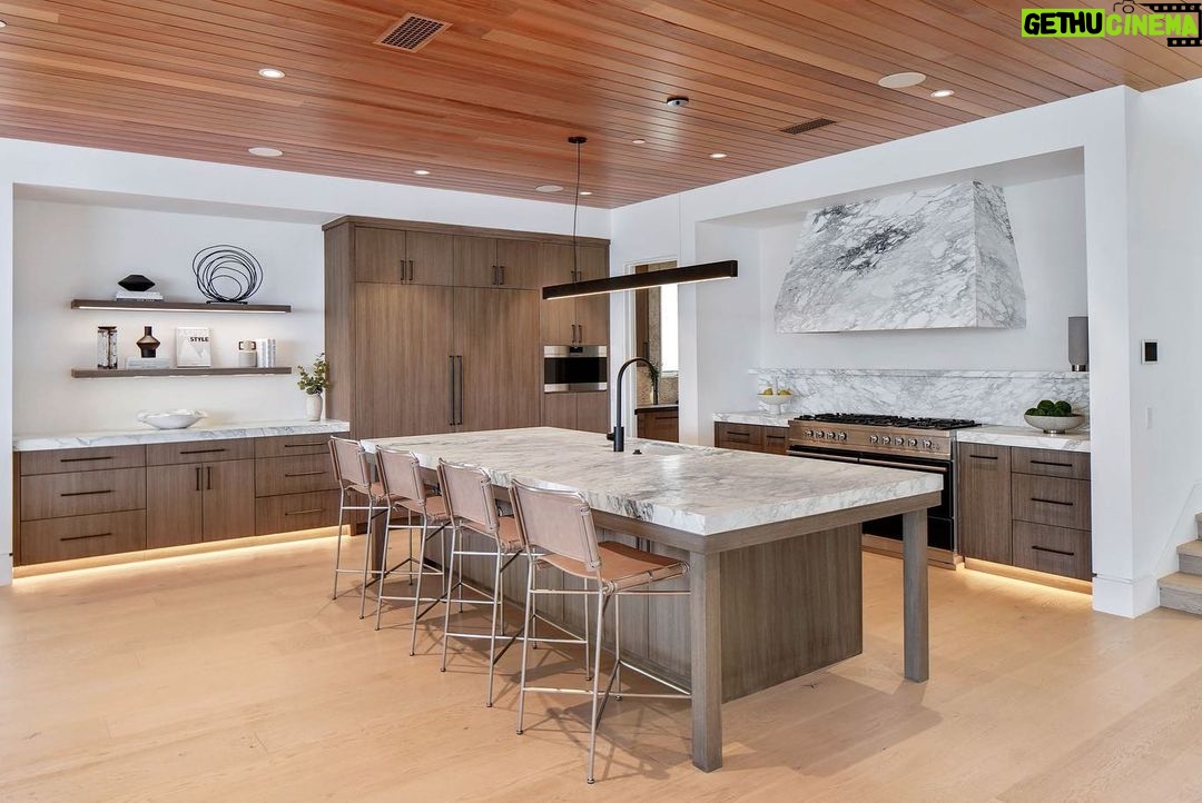 Jason Oppenheim - 53.2K Likes - Just Listed - 2201 Bayside Dr. - $27,995,000
5 Beds / 9 Baths / 9,129 Sq. Ft. / 11,921 Lot Size
This newly constructed custom estate offers exclusive Corona Del Mar waterfront living with intricate design touches and a harmonious blend of natural stone and wood elements. Consisting of 5 ensuite bedrooms and 9 bathrooms and boasting approximately 50 feet of private beachfront, it caters to water enthusiasts and offers shared ownership of one of the longest private docks on the west coast, capable of accommodating multiple yachts up to 100ft in length. Upon arrival, you will be greeted by meticulously landscaped surroundings, a striking grand pivot door, and a double height foyer that sets the tone for the residence. Inside, the space boasts European wide plank bleached oak flooring by Gaetano, illuminated floating staircases, and expansive glass features that fill the approximately 9,129 square feet of interiors with an abundance of natural light. The property seamlessly connects to its surroundings through slide-away pocket doors that open onto a heated patio, a zero-edge saltwater pool and spa, and a courtyard featuring a built-in Lynx Grill. The kitchen features custom Honed Calcatta Vagli slab countertops and backsplash, a 55" La Canche designer stove imported from Paris, a butler's pantry, and stained white oak cabinetry. Convenience is paramount, with a Waupaca elevator servicing all four floors, including the lower level, which encompasses a media area, a dry bar, and temperature controlled wine room. Upstairs, the owner's suite presents a heated wraparound balcony with mesmerizing water views, a living space with a fireplace, and two spa-like bathrooms, each complemented by its own walk-in closet. The top level reveals a lounge area that opens onto a rooftop deck with grass and sweeping views of the Newport Beach Harbor offering limitless ocean-view entertaining. Equipped with cutting-edge technology, the property also includes a nearly 3,000 sq. ft., 6+ car garage with epoxy flooring.
Listed by
@briancharlesfurstenfeld
@mskaylacardona
@jasonoppenheim