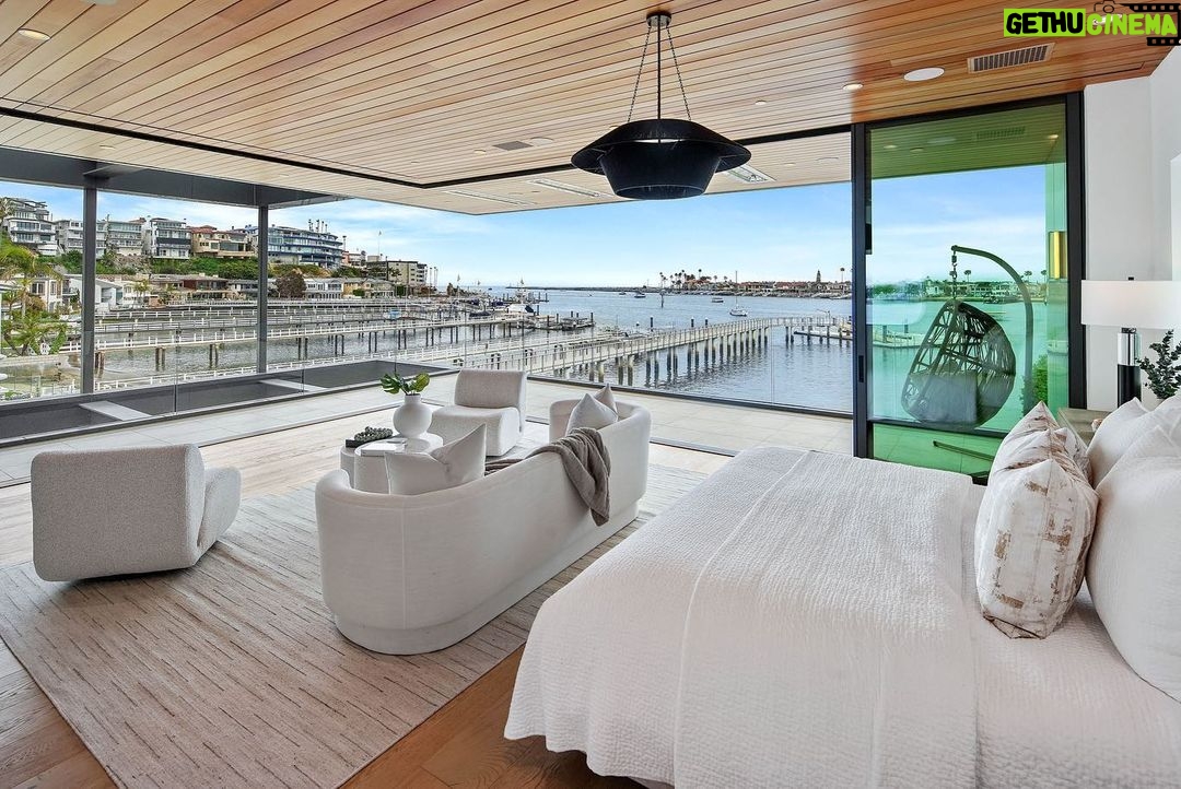 Jason Oppenheim - 53.2K Likes - Just Listed - 2201 Bayside Dr. - $27,995,000
5 Beds / 9 Baths / 9,129 Sq. Ft. / 11,921 Lot Size
This newly constructed custom estate offers exclusive Corona Del Mar waterfront living with intricate design touches and a harmonious blend of natural stone and wood elements. Consisting of 5 ensuite bedrooms and 9 bathrooms and boasting approximately 50 feet of private beachfront, it caters to water enthusiasts and offers shared ownership of one of the longest private docks on the west coast, capable of accommodating multiple yachts up to 100ft in length. Upon arrival, you will be greeted by meticulously landscaped surroundings, a striking grand pivot door, and a double height foyer that sets the tone for the residence. Inside, the space boasts European wide plank bleached oak flooring by Gaetano, illuminated floating staircases, and expansive glass features that fill the approximately 9,129 square feet of interiors with an abundance of natural light. The property seamlessly connects to its surroundings through slide-away pocket doors that open onto a heated patio, a zero-edge saltwater pool and spa, and a courtyard featuring a built-in Lynx Grill. The kitchen features custom Honed Calcatta Vagli slab countertops and backsplash, a 55" La Canche designer stove imported from Paris, a butler's pantry, and stained white oak cabinetry. Convenience is paramount, with a Waupaca elevator servicing all four floors, including the lower level, which encompasses a media area, a dry bar, and temperature controlled wine room. Upstairs, the owner's suite presents a heated wraparound balcony with mesmerizing water views, a living space with a fireplace, and two spa-like bathrooms, each complemented by its own walk-in closet. The top level reveals a lounge area that opens onto a rooftop deck with grass and sweeping views of the Newport Beach Harbor offering limitless ocean-view entertaining. Equipped with cutting-edge technology, the property also includes a nearly 3,000 sq. ft., 6+ car garage with epoxy flooring.
Listed by
@briancharlesfurstenfeld
@mskaylacardona
@jasonoppenheim