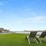 Jason Oppenheim Instagram - Just Listed - 2201 Bayside Dr. - $27,995,000 5 Beds / 9 Baths / 9,129 Sq. Ft. / 11,921 Lot Size This newly constructed custom estate offers exclusive Corona Del Mar waterfront living with intricate design touches and a harmonious blend of natural stone and wood elements. Consisting of 5 ensuite bedrooms and 9 bathrooms and boasting approximately 50 feet of private beachfront, it caters to water enthusiasts and offers shared ownership of one of the longest private docks on the west coast, capable of accommodating multiple yachts up to 100ft in length. Upon arrival, you will be greeted by meticulously landscaped surroundings, a striking grand pivot door, and a double height foyer that sets the tone for the residence. Inside, the space boasts European wide plank bleached oak flooring by Gaetano, illuminated floating staircases, and expansive glass features that fill the approximately 9,129 square feet of interiors with an abundance of natural light. The property seamlessly connects to its surroundings through slide-away pocket doors that open onto a heated patio, a zero-edge saltwater pool and spa, and a courtyard featuring a built-in Lynx Grill. The kitchen features custom Honed Calcatta Vagli slab countertops and backsplash, a 55" La Canche designer stove imported from Paris, a butler's pantry, and stained white oak cabinetry. Convenience is paramount, with a Waupaca elevator servicing all four floors, including the lower level, which encompasses a media area, a dry bar, and temperature controlled wine room. Upstairs, the owner's suite presents a heated wraparound balcony with mesmerizing water views, a living space with a fireplace, and two spa-like bathrooms, each complemented by its own walk-in closet. The top level reveals a lounge area that opens onto a rooftop deck with grass and sweeping views of the Newport Beach Harbor offering limitless ocean-view entertaining. Equipped with cutting-edge technology, the property also includes a nearly 3,000 sq. ft., 6+ car garage with epoxy flooring. Listed by @briancharlesfurstenfeld @mskaylacardona @jasonoppenheim Corona del Mar