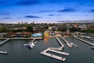 Jason Oppenheim Instagram - Just Listed - 2201 Bayside Dr. - $27,995,000

5 Beds / 9 Baths / 9,129 Sq. Ft. / 11,921 Lot Size

This newly constructed custom estate offers exclusive Corona Del Mar waterfront living with intricate design touches and a harmonious blend of natural stone and wood elements. Consisting of 5 ensuite bedrooms and 9 bathrooms and boasting approximately 50 feet of private beachfront, it caters to water enthusiasts and offers shared ownership of one of the longest private docks on the west coast, capable of accommodating multiple yachts up to 100ft in length. Upon arrival, you will be greeted by meticulously landscaped surroundings, a striking grand pivot door, and a double height foyer that sets the tone for the residence. Inside, the space boasts European wide plank bleached oak flooring by Gaetano, illuminated floating staircases, and expansive glass features that fill the approximately 9,129 square feet of interiors with an abundance of natural light. The property seamlessly connects to its surroundings through slide-away pocket doors that open onto a heated patio, a zero-edge saltwater pool and spa, and a courtyard featuring a built-in Lynx Grill. The kitchen features custom Honed Calcatta Vagli slab countertops and backsplash, a 55" La Canche designer stove imported from Paris, a butler's pantry, and stained white oak cabinetry. Convenience is paramount, with a Waupaca elevator servicing all four floors, including the lower level, which encompasses a media area, a dry bar, and temperature controlled wine room. Upstairs, the owner's suite presents a heated wraparound balcony with mesmerizing water views, a living space with a fireplace, and two spa-like bathrooms, each complemented by its own walk-in closet. The top level reveals a lounge area that opens onto a rooftop deck with grass and sweeping views of the Newport Beach Harbor offering limitless ocean-view entertaining. Equipped with cutting-edge technology, the property also includes a nearly 3,000 sq. ft., 6+ car garage with epoxy flooring.

Listed by 
@briancharlesfurstenfeld
@mskaylacardona
@jasonoppenheim