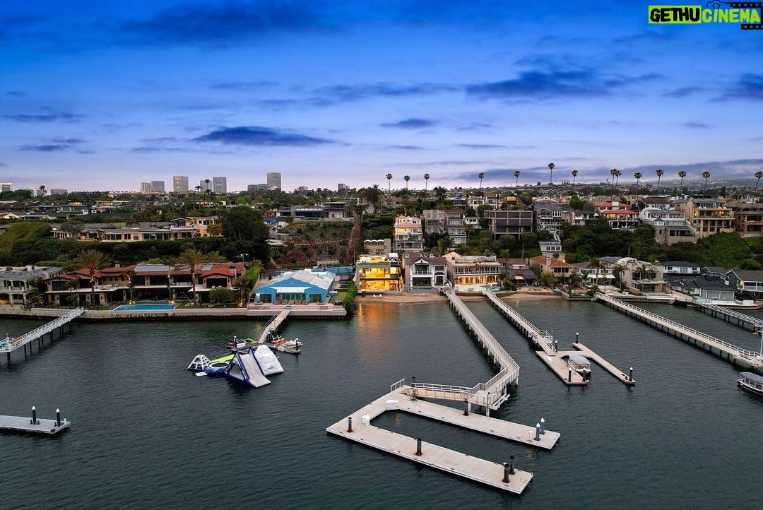 Jason Oppenheim - 53.2K Likes - Just Listed - 2201 Bayside Dr. - $27,995,000
5 Beds / 9 Baths / 9,129 Sq. Ft. / 11,921 Lot Size
This newly constructed custom estate offers exclusive Corona Del Mar waterfront living with intricate design touches and a harmonious blend of natural stone and wood elements. Consisting of 5 ensuite bedrooms and 9 bathrooms and boasting approximately 50 feet of private beachfront, it caters to water enthusiasts and offers shared ownership of one of the longest private docks on the west coast, capable of accommodating multiple yachts up to 100ft in length. Upon arrival, you will be greeted by meticulously landscaped surroundings, a striking grand pivot door, and a double height foyer that sets the tone for the residence. Inside, the space boasts European wide plank bleached oak flooring by Gaetano, illuminated floating staircases, and expansive glass features that fill the approximately 9,129 square feet of interiors with an abundance of natural light. The property seamlessly connects to its surroundings through slide-away pocket doors that open onto a heated patio, a zero-edge saltwater pool and spa, and a courtyard featuring a built-in Lynx Grill. The kitchen features custom Honed Calcatta Vagli slab countertops and backsplash, a 55" La Canche designer stove imported from Paris, a butler's pantry, and stained white oak cabinetry. Convenience is paramount, with a Waupaca elevator servicing all four floors, including the lower level, which encompasses a media area, a dry bar, and temperature controlled wine room. Upstairs, the owner's suite presents a heated wraparound balcony with mesmerizing water views, a living space with a fireplace, and two spa-like bathrooms, each complemented by its own walk-in closet. The top level reveals a lounge area that opens onto a rooftop deck with grass and sweeping views of the Newport Beach Harbor offering limitless ocean-view entertaining. Equipped with cutting-edge technology, the property also includes a nearly 3,000 sq. ft., 6+ car garage with epoxy flooring.
Listed by
@briancharlesfurstenfeld
@mskaylacardona
@jasonoppenheim