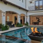 Jason Oppenheim Instagram - Just Listed in Newport Beach - 20101 S.W. Cypress St. - $14,995,000 or $43,500/mo. 6 Beds / 10 Baths / 13,260 Sq. Ft. / 26,572 Lot Size This state-of-the-art retreat boasts impeccable design on a .6-acre parcel in the Upper Back Bay. Set behind private gates, this compound-like residence features more than 13,200 sq. ft. of living space, 5 en-suite bedrooms, 10 baths, a soundproof home theater with memory foam carpet, game room, office, wine cellar, an attached guest house with private entry, two garages for 11 cars or a spacious home gym, Falsken water filtration system, and much more. No expense was spared in this refined custom estate with premium finishes throughout, including limestone flooring and baseboards, 12 ft. wood beam ceilings, and palatial corridors. The gourmet kitchen is fitted with state-of-the-art appliances, leathered granite kitchen counters, a butler’s pantry, and two kitchen islands with scratch and stain-resistant kedra countertops. The resort-style backyard showcases a pool/spa, outdoor shower, and massive loggia replete with lounge areas, bar, and a 1,500 sq. ft. covered outdoor kitchen featuring a built-in BBQ with a rotisserie grill, warming drawer, oversized glass refrigerator, nugget ice machine, and more. The 1,000 sq. ft. principal suite occupies its own wing, with an office or nursery space, boutique-style walk-in closet, spa bathroom, and fireplace. Conveniently located on the upper level, is a full-sized laundry room with dual washer and dryer units and a dog washing station; a third laundry set is situated in the lower-level butler’s pantry. The entire main house is wired to a generator in case of a power outage and is equipped with built-in audio, and extensive video surveillance and monitoring system. This exclusive address is a rare opportunity for those seeking privacy, opulence, and space just minutes away from the best destinations in Newport Beach. Newport Beach, California