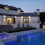 Jason Oppenheim Instagram – COMING SOON – 18541 Valley Dr. – $5,495,000

8 Beds / 8 Baths / 10,329 Sq. Ft. / 39,335 Lot Size

Located in Orange County’s prestigious Villa Park and set behind private gates on an elevated lot, this newly remodeled contemporary estate offers breathtaking views of the city and Catalina Island. Boasting 8 bedrooms, 8 baths, and over 10,000 sq. ft. of living space on an expansive nearly 40,000 sq. ft. lot, the home comes replete with every amenity necessary for luxe living and top-class entertainment. Enter into a light-filled foyer with double-height ceilings and a wrap-around staircase accentuated by a chandelier. The main level enjoys an open floor plan with flowing spaces accentuated by White Oak flooring. The cozy living area is framed by a wooden feature wall and marble fireplace. Adjacent to this, the dining area is replete with its own wooden accent feature wall, custom-built buffet cabinets, and designer chandelier. The chef’s kitchen features a full set of Thermador appliances, custom White Oak cabinetry, leathered granite backsplash and countertops, and a large cascading center island with seating. A spacious breakfast nook with additional storage completes the kitchen area, with its own semi-private room with a fireplace perfect for an additional family/TV room. This entire level enjoys access to the sweeping yard with a resort-style pool and spa with smart controls, a Cantilever pergola with rainfall feature, and built-in BBQ, all enjoying more gorgeous views. The split-level primary suite enjoys high ceilings, a sitting area, fireplace, private balcony with unobstructed views, his/her closets, and a breathtaking spa-like bathroom with dual vanity, touchless heated smart toilet, large walk-in steam shower, freestanding bathtub, and sauna. Additional amenities include a secondary owner’s suite with a large bathroom, a 1,000 sq. ft. theater with 11.2 Dolby Atmos system, two office spaces, a gym with massage room, a 4-car garage, and a 20-car motor court. Upgraded tech features include solar panels, dual EV charges, Smart Home automation, a 4K video surveillance system with local storage, and built-in Sonos speakers. Co-listed with @alexanderhuerta_
