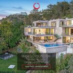 Jason Oppenheim Instagram - 📍 9406 Lloycrest Dr. Just reduced $6 million and now currently offered at $12,995,000, it is the best-priced home in Beverly Hills. 5 Beds / 9 Baths / 10,359 Sq. Ft. Located in the prestigious Crest Streets in Beverly Hills, this architectural masterpiece offers unobstructed jetliner views from every room. The new construction smart house features Venetian wall finishes throughout, imported stonework, floor-to-ceiling walls and doors of glass, and over 3,400 sq. ft. of outdoor terraces, creating an unprecedented living experience. The 2,000 sq. ft. primary suite boasts a private glam room, hair salon, 2 garden lounge sitting areas, dual walk-in closets, wet bar, and glass shoe display room. The gourmet kitchen comes replete with a butler kitchen and pantry area. The sophisticated living and dining area is accentuated with a fingerprint-secured Mezcal/Wine tasting room. The lower entertainment level offers a luxurious bar, spa and theatre experience, including a zero-edge pool, Himalayan salt sauna, Japanese soaking tub, private yoga studio/gym, Tonal fitness system, wet steam room, poolside cabana room, and 20 person theater with bar. The private lower grassy yard is surrounded by lush landscaping and includes a large entertainment game space. Co-listed with @alexanderhuerta_ @emmahernan Beverly Hills, California