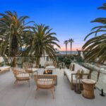 Jason Oppenheim Instagram - 🌴🤩 NEW LISTING 🤩🌴 1700 E Ocean Blvd 4 bed, 5 bath 3,520sqft Offered at: $8,950,000 Stunningly warm coastal farmhouse enveloped by iconic palm trees, situated on an oversized wide corner lot on the prestigious Peninsula Point. The 3-level home boasts pristine design and high-end finishes, including inviting white European oak floors outfitting the interiors, coupled with specialty tiles throughout the bathrooms. Custom White shiplap walls add another appealing component to each floor in the house. A chef’s kiss to the kitchen, it is topped with Calacatta marble and designer brass hardware with a large cascading waterfall island, large farmhouse sink, sleek white cabinets, and high-end appliances. The main level, with an open floor plan, comes replete with an airy and light-filled living area, a spacious dining area accentuated by a rustic white brick feature wall, cozy bar area, laundry room with double stacked appliances and powder bath. The custom pocket doors open the main level to the lower terrace boasting a fire pit, grill, and plenty of space for entertaining guests. The sleek primary suite includes large private balcony with breathtaking ocean view, spacious walk-in closet and a luxurious spa bathroom with dual vanities, a large soaking tub, oversized walk-in shower clad in marble, custom wood cabinetry with marble countertops, chic herringbone tile flooring, and mood lighting. The 3 spacious guest bedrooms luxuriate custom features throughout with one enjoying its own private balcony. The upper level has a custom-built minibar and a full bathroom complete with signature red-bricked walls. Behind folding glass doors, this level opens up to arguably the largest roof deck in the area. The magnificent 1,000+ sq. ft. rooftop terrace is truly an entertainer's dream with its multiple covered and uncovered lounging areas, fire pit, and a built-in grill and mini fridge, with stunning views overlooking the ocean, city and snowcapped mountains. A 3-car garage with Tesla/charging port, Sub-Zero fridge completes this rare offering, making it one of the best options out there for any discerning buyer. Listed with dream team: @jasonoppenheim & @justin_itzen