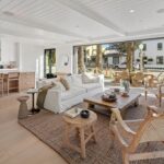 Jason Oppenheim Instagram - 🌴🤩 NEW LISTING 🤩🌴 1700 E Ocean Blvd 4 bed, 5 bath 3,520sqft Offered at: $8,950,000 Stunningly warm coastal farmhouse enveloped by iconic palm trees, situated on an oversized wide corner lot on the prestigious Peninsula Point. The 3-level home boasts pristine design and high-end finishes, including inviting white European oak floors outfitting the interiors, coupled with specialty tiles throughout the bathrooms. Custom White shiplap walls add another appealing component to each floor in the house. A chef’s kiss to the kitchen, it is topped with Calacatta marble and designer brass hardware with a large cascading waterfall island, large farmhouse sink, sleek white cabinets, and high-end appliances. The main level, with an open floor plan, comes replete with an airy and light-filled living area, a spacious dining area accentuated by a rustic white brick feature wall, cozy bar area, laundry room with double stacked appliances and powder bath. The custom pocket doors open the main level to the lower terrace boasting a fire pit, grill, and plenty of space for entertaining guests. The sleek primary suite includes large private balcony with breathtaking ocean view, spacious walk-in closet and a luxurious spa bathroom with dual vanities, a large soaking tub, oversized walk-in shower clad in marble, custom wood cabinetry with marble countertops, chic herringbone tile flooring, and mood lighting. The 3 spacious guest bedrooms luxuriate custom features throughout with one enjoying its own private balcony. The upper level has a custom-built minibar and a full bathroom complete with signature red-bricked walls. Behind folding glass doors, this level opens up to arguably the largest roof deck in the area. The magnificent 1,000+ sq. ft. rooftop terrace is truly an entertainer's dream with its multiple covered and uncovered lounging areas, fire pit, and a built-in grill and mini fridge, with stunning views overlooking the ocean, city and snowcapped mountains. A 3-car garage with Tesla/charging port, Sub-Zero fridge completes this rare offering, making it one of the best options out there for any discerning buyer. Listed with dream team: @jasonoppenheim & @justin_itzen
