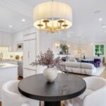 Jason Oppenheim Instagram - Just Listed Above The Sunset Strip - 1447 Queens Rd. - $3,495,000 2 Bed / 3 Bath / 2,307 Sq. Ft. Experience the epitome of glamour and sophistication with this stunningly restored Hollywood Regency replete with city views. Originally built by Robert Woolf alongside his partner, the legendary architect John Woolf, for their own personal residence, this property has recently undergone an artful restoration by renowned designer Tim Corrigan. Every detail has been meticulously considered to create an ultra-luxurious, alluring, and simply timeless atmosphere. Enter past the gated brick courtyard with fountain into the quintessential foyer featuring gorgeous black-and-white checkered marble floors. The main floor boasts a sitting room with beautiful crown molding and fireplace, along with an exquisite powder room with inlaid brass walls and an intricate one-of-a-kind medallion marble floor. The home has dual master suites (one on each floor) each equipped with their own ensuite baths that are strikingly finished with his-and-her sinks, built-in brass/silver fixtures, huge slabs of stone, and a plethora of closet space. Ascend the original brass railing staircase to the salon room, which features a second fireplace, French doors, and breathtaking city views. The large dining area and European kitchen with top-of-the-line appliances and backlit stone backsplash are perfect for entertaining. Outside, the private yard features a large pool, built-in BBQ, and mature hedging. A finished basement, along with a finished 2-car garage with French doors that lead to the yard, complete this remarkable property. Don’t miss this rare opportunity to own one of the most elegant and historic homes in Los Angeles.