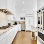 Jason Oppenheim Instagram - Just Listed Above The Sunset Strip - 1447 Queens Rd. - $3,495,000 2 Bed / 3 Bath / 2,307 Sq. Ft. Experience the epitome of glamour and sophistication with this stunningly restored Hollywood Regency replete with city views. Originally built by Robert Woolf alongside his partner, the legendary architect John Woolf, for their own personal residence, this property has recently undergone an artful restoration by renowned designer Tim Corrigan. Every detail has been meticulously considered to create an ultra-luxurious, alluring, and simply timeless atmosphere. Enter past the gated brick courtyard with fountain into the quintessential foyer featuring gorgeous black-and-white checkered marble floors. The main floor boasts a sitting room with beautiful crown molding and fireplace, along with an exquisite powder room with inlaid brass walls and an intricate one-of-a-kind medallion marble floor. The home has dual master suites (one on each floor) each equipped with their own ensuite baths that are strikingly finished with his-and-her sinks, built-in brass/silver fixtures, huge slabs of stone, and a plethora of closet space. Ascend the original brass railing staircase to the salon room, which features a second fireplace, French doors, and breathtaking city views. The large dining area and European kitchen with top-of-the-line appliances and backlit stone backsplash are perfect for entertaining. Outside, the private yard features a large pool, built-in BBQ, and mature hedging. A finished basement, along with a finished 2-car garage with French doors that lead to the yard, complete this remarkable property. Don’t miss this rare opportunity to own one of the most elegant and historic homes in Los Angeles.