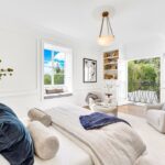 Jason Oppenheim Instagram - Just Listed Above The Sunset Strip - 1447 Queens Rd. - $3,495,000 2 Bed / 3 Bath / 2,307 Sq. Ft. Experience the epitome of glamour and sophistication with this stunningly restored Hollywood Regency replete with city views. Originally built by Robert Woolf alongside his partner, the legendary architect John Woolf, for their own personal residence, this property has recently undergone an artful restoration by renowned designer Tim Corrigan. Every detail has been meticulously considered to create an ultra-luxurious, alluring, and simply timeless atmosphere. Enter past the gated brick courtyard with fountain into the quintessential foyer featuring gorgeous black-and-white checkered marble floors. The main floor boasts a sitting room with beautiful crown molding and fireplace, along with an exquisite powder room with inlaid brass walls and an intricate one-of-a-kind medallion marble floor. The home has dual master suites (one on each floor) each equipped with their own ensuite baths that are strikingly finished with his-and-her sinks, built-in brass/silver fixtures, huge slabs of stone, and a plethora of closet space. Ascend the original brass railing staircase to the salon room, which features a second fireplace, French doors, and breathtaking city views. The large dining area and European kitchen with top-of-the-line appliances and backlit stone backsplash are perfect for entertaining. Outside, the private yard features a large pool, built-in BBQ, and mature hedging. A finished basement, along with a finished 2-car garage with French doors that lead to the yard, complete this remarkable property. Don’t miss this rare opportunity to own one of the most elegant and historic homes in Los Angeles.