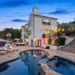 Jason Oppenheim Instagram - Just Listed in Studio City - 11231 Briarcliff Ln. - $5,995,000 6 Beds / 6 Baths / 6,715 Sq. Ft. / 24,087 Lot Size Situated on a private, gated cul-de-sac in the hills of Studio City sits this exclusive Spanish estate with a guest studio overlooking breathtaking canyon and city views. With over a half-acre lot, bask in the sun on expansive resort-like patios, lounge by the pool and spa, and entertain guests with the built-in BBQ and wood-burning fireplace amongst multiple grassy lawns. The spacious 5-bedroom home boasts an abundance of natural light, soaring ceilings, and custom details throughout. The recently remodeled gourmet kitchen features top-of-the-line appliances and breakfast area, with a separate formal dining room. A cinema quality theater and guest bedroom complete the first floor. The master suite is a true oasis, complete with a sitting area, fireplace, dual walk-in closets, and an oversized bathroom with a jacuzzi tub. The property also offers an attached guest studio with a separate entrance featuring its own kitchenette, bathroom, and walk-in closet. Three-car garage and walled courtyard offer ample parking and seclusion behind secured gates.