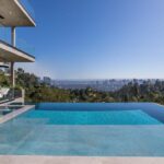 Jason Oppenheim Instagram - 📍 9406 Lloycrest Dr. Just reduced $6 million and now currently offered at $12,995,000, it is the best-priced home in Beverly Hills. 5 Beds / 9 Baths / 10,359 Sq. Ft. Located in the prestigious Crest Streets in Beverly Hills, this architectural masterpiece offers unobstructed jetliner views from every room. The new construction smart house features Venetian wall finishes throughout, imported stonework, floor-to-ceiling walls and doors of glass, and over 3,400 sq. ft. of outdoor terraces, creating an unprecedented living experience. The 2,000 sq. ft. primary suite boasts a private glam room, hair salon, 2 garden lounge sitting areas, dual walk-in closets, wet bar, and glass shoe display room. The gourmet kitchen comes replete with a butler kitchen and pantry area. The sophisticated living and dining area is accentuated with a fingerprint-secured Mezcal/Wine tasting room. The lower entertainment level offers a luxurious bar, spa and theatre experience, including a zero-edge pool, Himalayan salt sauna, Japanese soaking tub, private yoga studio/gym, Tonal fitness system, wet steam room, poolside cabana room, and 20 person theater with bar. The private lower grassy yard is surrounded by lush landscaping and includes a large entertainment game space. Co-listed with @alexanderhuerta_ @emmahernan Beverly Hills, California
