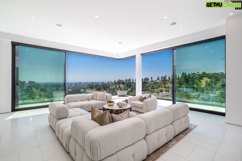 Jason Oppenheim Instagram - 📍 9406 Lloycrest Dr. Just reduced $6 million and now currently offered at $12,995,000, it is the best-priced home in Beverly Hills. 5 Beds / 9 Baths / 10,359 Sq. Ft. Located in the prestigious Crest Streets in Beverly Hills, this architectural masterpiece offers unobstructed jetliner views from every room. The new construction smart house features Venetian wall finishes throughout, imported stonework, floor-to-ceiling walls and doors of glass, and over 3,400 sq. ft. of outdoor terraces, creating an unprecedented living experience. The 2,000 sq. ft. primary suite boasts a private glam room, hair salon, 2 garden lounge sitting areas, dual walk-in closets, wet bar, and glass shoe display room. The gourmet kitchen comes replete with a butler kitchen and pantry area. The sophisticated living and dining area is accentuated with a fingerprint-secured Mezcal/Wine tasting room. The lower entertainment level offers a luxurious bar, spa and theatre experience, including a zero-edge pool, Himalayan salt sauna, Japanese soaking tub, private yoga studio/gym, Tonal fitness system, wet steam room, poolside cabana room, and 20 person theater with bar. The private lower grassy yard is surrounded by lush landscaping and includes a large entertainment game space. Co-listed with @alexanderhuerta_ @emmahernan Beverly Hills, California