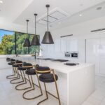 Jason Oppenheim Instagram - 📍 9406 Lloycrest Dr. Just reduced $6 million and now currently offered at $12,995,000, it is the best-priced home in Beverly Hills. 5 Beds / 9 Baths / 10,359 Sq. Ft. Located in the prestigious Crest Streets in Beverly Hills, this architectural masterpiece offers unobstructed jetliner views from every room. The new construction smart house features Venetian wall finishes throughout, imported stonework, floor-to-ceiling walls and doors of glass, and over 3,400 sq. ft. of outdoor terraces, creating an unprecedented living experience. The 2,000 sq. ft. primary suite boasts a private glam room, hair salon, 2 garden lounge sitting areas, dual walk-in closets, wet bar, and glass shoe display room. The gourmet kitchen comes replete with a butler kitchen and pantry area. The sophisticated living and dining area is accentuated with a fingerprint-secured Mezcal/Wine tasting room. The lower entertainment level offers a luxurious bar, spa and theatre experience, including a zero-edge pool, Himalayan salt sauna, Japanese soaking tub, private yoga studio/gym, Tonal fitness system, wet steam room, poolside cabana room, and 20 person theater with bar. The private lower grassy yard is surrounded by lush landscaping and includes a large entertainment game space. Co-listed with @alexanderhuerta_ @emmahernan Beverly Hills, California