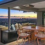 Jason Oppenheim Instagram - Just Listed - 8700 Franklin Ave. - $4,995,000 3 Bed / 3 Baths / 2,766 Sq. Ft. / 16,384 Lot Size Situated on its own promontory at the end of a quiet cul-de-sac street just above the Sunset Strip, this private mid-century home features unrivaled jetliner panoramic views of the entire city to the ocean. The swimmer's pool and outdoor patio evoke feelings of a five-star resort with an additional 20-foot waterfall, spa, and fire pit. Enter past the floor-to-ceiling front door to an open floor plan with a gorgeous living room, vaulted wood-beamed ceilings, a see-through fireplace, and a dining area with incredible views from every room. The sleek kitchen is complete with contemporary, top-of-the-line appliances. An additional bedroom, bathroom, and laundry room complete the main floor. A custom steel wall and floating staircase lead below to a large seating area and the luxurious owner's suite replete with a spa-like bathroom and walk-in closet, all opening to a massive deck. The third bedroom with an ensuite bath has floor-to-ceiling sliding doors perfect for an office or extra guest room. Detached 2-car garage and 2 uncovered parking spaces. The Sunset Strip
