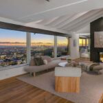 Jason Oppenheim Instagram - Just Listed - 8700 Franklin Ave. - $4,995,000 3 Bed / 3 Baths / 2,766 Sq. Ft. / 16,384 Lot Size Situated on its own promontory at the end of a quiet cul-de-sac street just above the Sunset Strip, this private mid-century home features unrivaled jetliner panoramic views of the entire city to the ocean. The swimmer's pool and outdoor patio evoke feelings of a five-star resort with an additional 20-foot waterfall, spa, and fire pit. Enter past the floor-to-ceiling front door to an open floor plan with a gorgeous living room, vaulted wood-beamed ceilings, a see-through fireplace, and a dining area with incredible views from every room. The sleek kitchen is complete with contemporary, top-of-the-line appliances. An additional bedroom, bathroom, and laundry room complete the main floor. A custom steel wall and floating staircase lead below to a large seating area and the luxurious owner's suite replete with a spa-like bathroom and walk-in closet, all opening to a massive deck. The third bedroom with an ensuite bath has floor-to-ceiling sliding doors perfect for an office or extra guest room. Detached 2-car garage and 2 uncovered parking spaces. The Sunset Strip