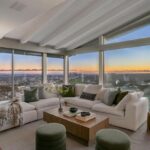 Jason Oppenheim Instagram - Just Listed - 8700 Franklin Ave. - $4,995,000 3 Bed / 3 Baths / 2,766 Sq. Ft. / 16,384 Lot Size Situated on its own promontory at the end of a quiet cul-de-sac street just above the Sunset Strip, this private mid-century home features unrivaled jetliner panoramic views of the entire city to the ocean. The swimmer's pool and outdoor patio evoke feelings of a five-star resort with an additional 20-foot waterfall, spa, and fire pit. Enter past the floor-to-ceiling front door to an open floor plan with a gorgeous living room, vaulted wood-beamed ceilings, a see-through fireplace, and a dining area with incredible views from every room. The sleek kitchen is complete with contemporary, top-of-the-line appliances. An additional bedroom, bathroom, and laundry room complete the main floor. A custom steel wall and floating staircase lead below to a large seating area and the luxurious owner's suite replete with a spa-like bathroom and walk-in closet, all opening to a massive deck. The third bedroom with an ensuite bath has floor-to-ceiling sliding doors perfect for an office or extra guest room. Detached 2-car garage and 2 uncovered parking spaces. The Sunset Strip