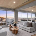 Jason Oppenheim Instagram - After two painstaking years and far too many millions of dollars, I have finally finished the remodel at the top floor of 7135 Hollywood Blvd., consisting of two beautiful penthouses, each offered at $7,495,000. Videos of each PH included in carousel. Penthouse East The most unique and exquisitely finished penthouse in all of Los Angeles, showcasing jetliner 360-degree views from the Hollywood sign to downtown and the ocean, as well as 2,885 sq. ft. of private outdoor deck space. Spanning half of the entire top floor in Hollywood's most exclusive full-service building (w/valet, doorman, and 24-hour security), Penthouse East has undergone a painstaking 2-year remodel to create the most sophisticated and mesmerizing residence in the entire city. Totaling 3,580 sq. ft. of interior living space with 3 bedrooms plus an office and 4 bathrooms, this penthouse is replete with an open living/dining room and built-in bar, floor-to-ceiling glass windows and sliding doors, exposed concrete beams, wide European oak flooring, and giant slabs of gorgeous Calacatta marble and Travertine limestone throughout. A chef’s kitchen is fitted with Gaggenau appliances and custom European cabinetry. The luxurious owner’s suite boasts a separate sitting area, fireplace, and ensuite bathroom with a free-standing soaking tub, spa-like shower, custom-cut Travertine sink, and an oversized showroom-style walk-in closet. The Penthouse offers smart home tech and two movie projector systems that drop from the ceiling, in both the living room and primary bedroom, with built-in surround sound. 4 dedicated parking spaces are included with the PH. Building amenities include a 24-hour valet, doorman, security, pool, recreation room, fitness center, dog park, and more. An unrivaled offering compared to other luxury condos when considering the design and quality of finishes, size/scale, unobstructed views, and outdoor deck space. Penthouse West (3,820 sq. ft. of interior living space with 1,685 sq. ft. exterior deck) is also available at $7,495,000, completing the entire top floor of the building. Thank you @whitegloveestates for the remodel and @vesta and @ashstaging for the amazing staging!! The Sunset Strip
