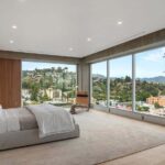 Jason Oppenheim Instagram - After two painstaking years and far too many millions of dollars, I have finally finished the remodel at the top floor of 7135 Hollywood Blvd., consisting of two beautiful penthouses, each offered at $7,495,000. Videos of each PH included in carousel. Penthouse East The most unique and exquisitely finished penthouse in all of Los Angeles, showcasing jetliner 360-degree views from the Hollywood sign to downtown and the ocean, as well as 2,885 sq. ft. of private outdoor deck space. Spanning half of the entire top floor in Hollywood's most exclusive full-service building (w/valet, doorman, and 24-hour security), Penthouse East has undergone a painstaking 2-year remodel to create the most sophisticated and mesmerizing residence in the entire city. Totaling 3,580 sq. ft. of interior living space with 3 bedrooms plus an office and 4 bathrooms, this penthouse is replete with an open living/dining room and built-in bar, floor-to-ceiling glass windows and sliding doors, exposed concrete beams, wide European oak flooring, and giant slabs of gorgeous Calacatta marble and Travertine limestone throughout. A chef’s kitchen is fitted with Gaggenau appliances and custom European cabinetry. The luxurious owner’s suite boasts a separate sitting area, fireplace, and ensuite bathroom with a free-standing soaking tub, spa-like shower, custom-cut Travertine sink, and an oversized showroom-style walk-in closet. The Penthouse offers smart home tech and two movie projector systems that drop from the ceiling, in both the living room and primary bedroom, with built-in surround sound. 4 dedicated parking spaces are included with the PH. Building amenities include a 24-hour valet, doorman, security, pool, recreation room, fitness center, dog park, and more. An unrivaled offering compared to other luxury condos when considering the design and quality of finishes, size/scale, unobstructed views, and outdoor deck space. Penthouse West (3,820 sq. ft. of interior living space with 1,685 sq. ft. exterior deck) is also available at $7,495,000, completing the entire top floor of the building. Thank you @whitegloveestates for the remodel and @vesta and @ashstaging for the amazing staging!! The Sunset Strip