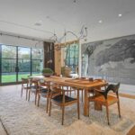 Jason Oppenheim Instagram - Just Listed - 1375 N. Doheny Dr. - $28,500,000 5 Beds / 9 Baths / 10,613 Sq. Ft. / 17,438 Lot Size Recently gracing the prestigious cover of Architectural Digest, this estate stands as an embodiment of timeless sophistication, meticulously curated from materials all over the world to create one of the most special homes in all of Los Angeles. Discreetly concealed beyond a privately gated driveway, an oversized motor court is laid with 200+ year-old reclaimed cobblestone from the historic streets of Boston. Experience the epitome of refined living with an open floor plan, double-height ceilings, and palatial steel-framed Crittal sliding glass doors which seamlessly unite the interior/outdoor spaces including a serene pool, covered patio, and verdant lawn. The sensuous chef’s kitchen is an epicurean haven boasting custom bronze-patinated cabinets, top-of-the-line appliances including floating burners by Pitt, and 20 slabs of book-matched Calacatta marble bearing an Rorschach-like allure. The owner’s suite bath, inspired by Jean Michel Frank - a French art deco architect known for his soft, undulating lines - stands as the quintessence of unparalleled elegance and decadence; every square inch has been cocooned in 40 slabs of Calacatta Breccia Capraia, (an impossibly rare marble from Italy that was used throughout Italian churches for hundreds of years) including the steam shower’s built-in chaise lounge to the monolithic tub hewn from a single block of stone, all paired with opulent Waterworks fixtures. Bespoke amenities include an office wrapped in an envelope of reclaimed French Oak, a state-of-the-art theater, wine cellar, gym, recreation room, private library, unrivaled security, and audio/visual integration. Unquestionably the most impressively crafted and composed property available, tailored for the most discerning buyer desiring perfection. Listed by @themarybonnet @jasonoppenheim