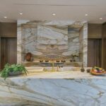 Jason Oppenheim Instagram - Just Listed - 1375 N. Doheny Dr. - $28,500,000 5 Beds / 9 Baths / 10,613 Sq. Ft. / 17,438 Lot Size Recently gracing the prestigious cover of Architectural Digest, this estate stands as an embodiment of timeless sophistication, meticulously curated from materials all over the world to create one of the most special homes in all of Los Angeles. Discreetly concealed beyond a privately gated driveway, an oversized motor court is laid with 200+ year-old reclaimed cobblestone from the historic streets of Boston. Experience the epitome of refined living with an open floor plan, double-height ceilings, and palatial steel-framed Crittal sliding glass doors which seamlessly unite the interior/outdoor spaces including a serene pool, covered patio, and verdant lawn. The sensuous chef’s kitchen is an epicurean haven boasting custom bronze-patinated cabinets, top-of-the-line appliances including floating burners by Pitt, and 20 slabs of book-matched Calacatta marble bearing an Rorschach-like allure. The owner’s suite bath, inspired by Jean Michel Frank - a French art deco architect known for his soft, undulating lines - stands as the quintessence of unparalleled elegance and decadence; every square inch has been cocooned in 40 slabs of Calacatta Breccia Capraia, (an impossibly rare marble from Italy that was used throughout Italian churches for hundreds of years) including the steam shower’s built-in chaise lounge to the monolithic tub hewn from a single block of stone, all paired with opulent Waterworks fixtures. Bespoke amenities include an office wrapped in an envelope of reclaimed French Oak, a state-of-the-art theater, wine cellar, gym, recreation room, private library, unrivaled security, and audio/visual integration. Unquestionably the most impressively crafted and composed property available, tailored for the most discerning buyer desiring perfection. Listed by @themarybonnet @jasonoppenheim