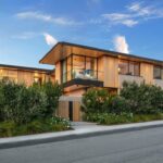 Jason Oppenheim Instagram - Just Listed in Manhattan Beach - 1001 1st St. - $29,900,000 6 Beds / 9 Baths / 9,479 Sq. Ft. The most impressive and high-quality Contemporary estate ever built in Manhattan Beach, featuring panoramic ocean views from every room. After a laborious multi-year build, this approximately 9,500 sq. ft. showstopper seamlessly fuses glass, cedar, and concrete into a triumphant architectural tour de force with a sense of permanence and grandeur. Integral to the structure and aesthetic of the home, the scalloped concrete walls seen on the exterior and interior walls resemble an undulating wave-like texture accomplished by custom milled formwork which complement the surrounding Pacific landscape. Custom cedar clads the remaining walls and ceilings, bringing warmth and visual impact throughout the sleek space. Double-height ceilings and oversized automated Otiima pocketing doors and windows create a sense of expansion within, as the home seamlessly unfolds into an extensive beautifully landscaped outdoor terrace and pool/spa perfect for California living. An additional shaded patio with fireplace is created by the deep cedar overhangs from the upper floor and the roof. Generously nestled on an extra-wide corner lot, the home is replete with 6 bedrooms plus an additional office/nursery, 9 bathrooms, home theater, game room, wine cellar, wet bar, and gym, with architecture by Laney LA. Additional amenities include 48 solar panels with Tesla Powerwalls, elevator, 14 zone A/C technology platform system, Control4 home automation, and 3-car garage with additional driveway parking. An exceptionally rare opportunity to own a meticulously crafted beach estate with soul and sophistication. Manhattan Beach, California