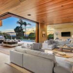 Jason Oppenheim Instagram - Just Listed in Manhattan Beach - 1001 1st St. - $29,900,000 6 Beds / 9 Baths / 9,479 Sq. Ft. The most impressive and high-quality Contemporary estate ever built in Manhattan Beach, featuring panoramic ocean views from every room. After a laborious multi-year build, this approximately 9,500 sq. ft. showstopper seamlessly fuses glass, cedar, and concrete into a triumphant architectural tour de force with a sense of permanence and grandeur. Integral to the structure and aesthetic of the home, the scalloped concrete walls seen on the exterior and interior walls resemble an undulating wave-like texture accomplished by custom milled formwork which complement the surrounding Pacific landscape. Custom cedar clads the remaining walls and ceilings, bringing warmth and visual impact throughout the sleek space. Double-height ceilings and oversized automated Otiima pocketing doors and windows create a sense of expansion within, as the home seamlessly unfolds into an extensive beautifully landscaped outdoor terrace and pool/spa perfect for California living. An additional shaded patio with fireplace is created by the deep cedar overhangs from the upper floor and the roof. Generously nestled on an extra-wide corner lot, the home is replete with 6 bedrooms plus an additional office/nursery, 9 bathrooms, home theater, game room, wine cellar, wet bar, and gym, with architecture by Laney LA. Additional amenities include 48 solar panels with Tesla Powerwalls, elevator, 14 zone A/C technology platform system, Control4 home automation, and 3-car garage with additional driveway parking. An exceptionally rare opportunity to own a meticulously crafted beach estate with soul and sophistication. Manhattan Beach, California