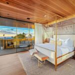 Jason Oppenheim Instagram - Just Listed in Manhattan Beach - 1001 1st St. - $29,900,000 6 Beds / 9 Baths / 9,479 Sq. Ft. The most impressive and high-quality Contemporary estate ever built in Manhattan Beach, featuring panoramic ocean views from every room. After a laborious multi-year build, this approximately 9,500 sq. ft. showstopper seamlessly fuses glass, cedar, and concrete into a triumphant architectural tour de force with a sense of permanence and grandeur. Integral to the structure and aesthetic of the home, the scalloped concrete walls seen on the exterior and interior walls resemble an undulating wave-like texture accomplished by custom milled formwork which complement the surrounding Pacific landscape. Custom cedar clads the remaining walls and ceilings, bringing warmth and visual impact throughout the sleek space. Double-height ceilings and oversized automated Otiima pocketing doors and windows create a sense of expansion within, as the home seamlessly unfolds into an extensive beautifully landscaped outdoor terrace and pool/spa perfect for California living. An additional shaded patio with fireplace is created by the deep cedar overhangs from the upper floor and the roof. Generously nestled on an extra-wide corner lot, the home is replete with 6 bedrooms plus an additional office/nursery, 9 bathrooms, home theater, game room, wine cellar, wet bar, and gym, with architecture by Laney LA. Additional amenities include 48 solar panels with Tesla Powerwalls, elevator, 14 zone A/C technology platform system, Control4 home automation, and 3-car garage with additional driveway parking. An exceptionally rare opportunity to own a meticulously crafted beach estate with soul and sophistication. Manhattan Beach, California