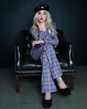 Jenna Davis Instagram - @meetm3gan in theaters now🖤I feel honored to be apart of this film. To our director, @gerardjohnstone you are a ray of visionary talent, I feel honored and had a blast combining our visions. I’m beyond thankful @universalpictures @blumhouse @atomicmonster @akelacooper @susanboyajian for granting me the opportunity. Grab your popcorn, meet M3GAN, and let me know what you think of your new bestie 🔪

pc: @ashleyrobertsphotos 
hair/mua: @nixeyartistry 
stylist: @styledbylmc 
purple suit: @majorelle_collection 
heels: @larroude 
bourree: @prettylittlething 
earrings: @kendrascott 
necklaces: @maisonmiru