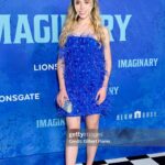 Jenna Davis Instagram - All the feathers 💙 I had such a blast with my @meetm3gan & @blumhouse family celebrating their new film @imaginaryfilm ✨ 💇‍♀️: @hairbybradleyleake ✨: @styledbylmc 👗: @shopakira 👛: @ahikozaofficial 👠: @charleskeithofficial