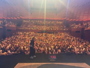 Jennette McCurdy Instagram - speaking at the sydney opera house was unforgettable !! years ago, i hit what i consider my “rock bottom” in australia, in the backseat of an uber, while looking at the sydney opera house from afar, down a tooth and a lot of hope, fresh off purging my tim tams. i was at a place where i didn’t really believe things could get better, but knew if there was any chance of that happening, of things changing, that i was gonna have to start by changing the only thing i had any control over: myself. 

to have gone back to australia now, years later, under completely different circumstances - for a career i am proud of and, more importantly, as a person i am proud of - and to connect with an audience in a real, meaningful way (IN THE FUCKING SYDNEY OPERA HOUSE ITSELF !! ) was a once-in-a-lifetime moment for me. 

thanks to the @sydneyoperahouse for having me out, to @rosiewaterland for conducting an incredibly nuanced and thoughtful conversation with grace and humor and everything in between, and of course to every one of you who came out to the event. you were an insightful, good-humored bunch and i’m so glad and grateful to have spent some time with you. 

afterward, i celebrated with a half-sleeve of tim tams, all of which remain unpurged. 

ps yes my trip aesthetic was “full tourist”.
