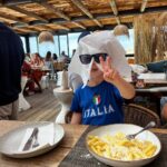 Jesse Tyler Ferguson Instagram - cheesy toddler eating cheesy pasta around the 🌎 Lisbon, Portugal
