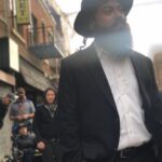 Joe Lo Truglio Instagram - 🚨BTS🚨”Cinco De Mayo” Heist, Season 6. This was a fun day and Terry was a living trophy. 🏆Not easy makeup to be in for ten hours, but golden attitude. I remember thinking how wonderfully outrageous this show is, as us weirdos pushed a shopping cart as fast as we could down the street Seinfeld used to shoot on. 🤯 #b99mems