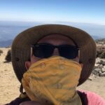 Joe Lo Truglio Instagram – 🌞Last Wednesday I climbed to the summit of Mt Baldy with some buds.  10,000 ft.  We started at San Antonio Falls, an elevation of 6,000 ft.  Four hours, fifteen minutes up. 
Two hours fifty minutes down. 
It destroyed my legs but exploded my spirit. Still feeling the ripples of both. Next day, I go to Joshua Tree. All muscles at Defcon  1 so my hand starts spasming.  I laugh because that’s all I can do at 70 mph.  I land in the desert and spend two nights.  It’s like sleeping in a planetarium.  Infinite stars.  Mars is out and red as hell.  I see the comet 🌠before it goes away for another 6800 years.  Discovered some constellations: Scorpio ♏️and Saggitarius♐️. The world is insane and the future unknown but in just four days I’ve been able to reset the compass.  Friends, you won’t regret it.  Get outside.  Test your limits.  Challenge your stamina.  If it hurts, even better.  You’ll feel alive and not numb to all this noise thrown at you everyday.  If you can, climb.  If it’s at night, look up.  Check your water supply.  Tell your people you love them.  And wear a f*cking mask. 
☀️☀️☀️☀️☀️☀️
I challenge fellow cast mates, the incomparable @melissafumero and @stephaniebeatriz, as well as my old friends, @kenmarino and @thomaspatricklennon to #WearAMask
💫💫💫💫
PS. You do not have to be at 10,000 ft but EXTRA POINTS if you are.