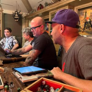 Joe Manganiello Instagram - Got the band back together after three years of remote play and no play… 
WAR OF DRAGONS Episode 73 kicked off with a food truck and a two hour recap from the very first adventure five years ago, all the way through to the present. 
The Sandal of Gygax made its appearance as it settled into its new home for the next calendar year at The E. Gary Gygax Memorial Dungeon in Beverly Park next to a set of Gary’s dice gifted to me by his son Luke for my 42nd birthday a few years back. 
Vince spearheaded a surprise for me, a framed piece of art by Max Dunbar that was used to craft the Wizkids miniatures sets, including all of the characters in the group but this time, with a looming Tiamat above. So f-ing cool…
It was a blast seeing everyone in person! Can’t wait for the next session.
