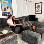 Joel Courtney Instagram - Who wants to come over for a movie night?! 🙋🏻‍♂️🍿 Thanks to @lovesac, the Courtney family now has the most epic entertainment couch. It has 6 hidden surround sound speakers, a subwoofer, and is comfortable enough to binge watch an entire tv show. My dream movie room has never been so perfect. So, what’re we watching? #lovesac #lovesacpartner #entertainmentroom #movieroomcouch