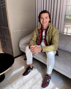 Joel Courtney Instagram - I love me some @coach and don’t get me started on these #redbottoms @louboutinworld 
Styled - @ashleypweston 
Grooming - @nicoleellemakeup 
📸 - the one and only @mia_scholink 
Brought to you by @nickifioravante with @viewpoint.pr #pressday #pressjunket

What’s your favorite shoe? 👇🏼👇🏼