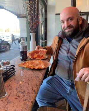 Joey Diaz Instagram - Lee enjoying a tremendous slice of pizza at Carlo’s….