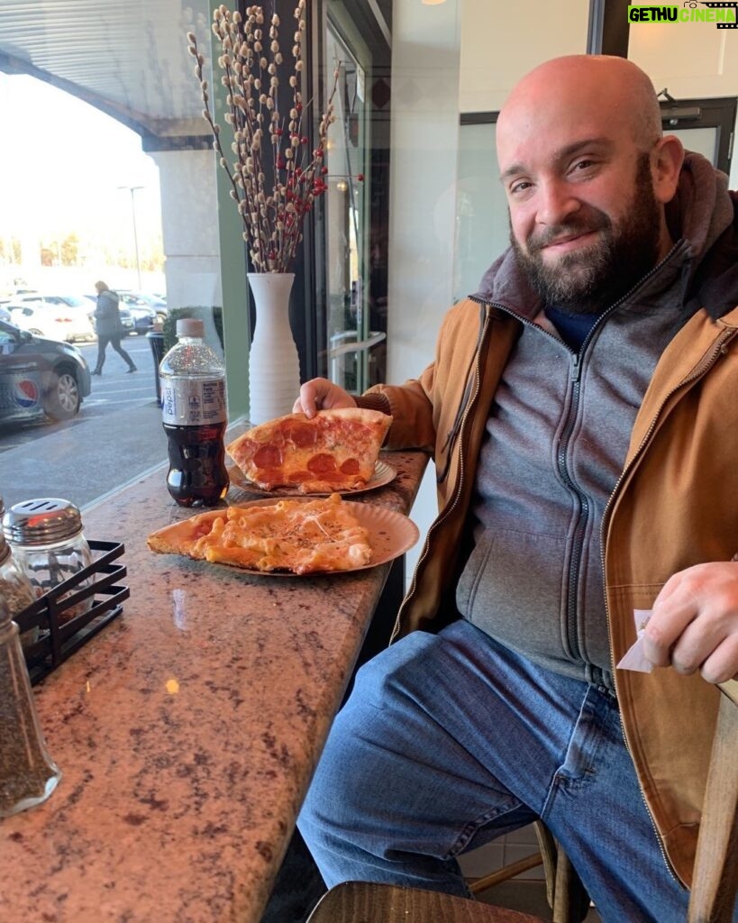Joey Diaz Instagram - Lee enjoying a tremendous slice of pizza at Carlo’s….