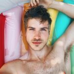 Joey Graceffa Instagram - I’m not quarantining I’m queer-a-tanning 🌈 drop me emojis of your favorite color 🩱🦕🦚