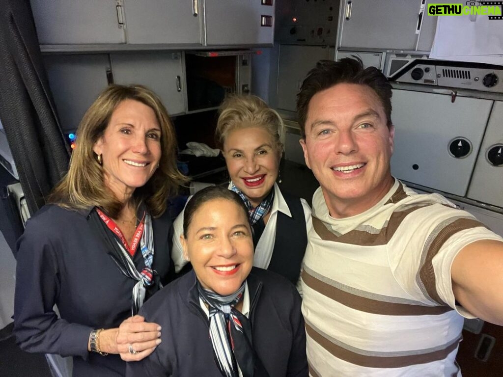 John Barrowman Instagram - It was team work today on our @americanair flight from Los Angeles to London. I became the honorary Engineer on the flight helping this fantastic team. I’ll tell you the story at the panel. @comicconafrica #travel #lgbtq #Fanfamily #airline #problemsolving Heathrow Airport