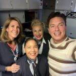 John Barrowman Instagram - It was team work today on our @americanair flight from Los Angeles to London. I became the honorary Engineer on the flight helping this fantastic team. I’ll tell you the story at the panel. @comicconafrica #travel #lgbtq #Fanfamily #airline #problemsolving Heathrow Airport