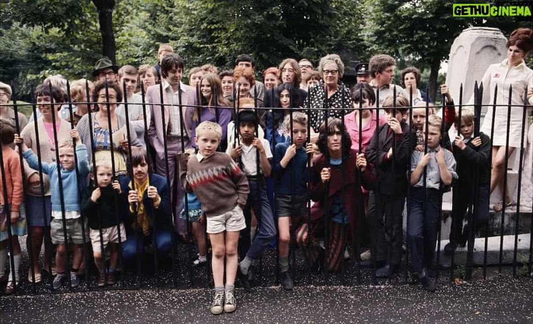 John Lennon Instagram - MAD DAY OUT. Ian Whittington remembers posing for Don McCullin with the Fab Four, 28 July 1968 Ian Whittington: This is St Pancras Old Church and gardens, in north London. My grandad, Jack, was the head gardener. He was visiting family in Derbyshire that day: he always said if he had been there, he wouldn’t have allowed the Beatles in, because they were the sort of “long-haired layabouts” he disapproved of. He was upright and Victorian, dressed in corduroy trousers, waistcoat, jacket and tie, even when he was working. I’m the little boy on the left in the light blue jumper, and I’m six years old. Standing next to me is my younger brother Neil and behind us is our nan, Eunice. She’s holding paper and a pencil, as we got three of the Beatles’ autographs. Yoko Ono, who was there that day, kept calling John Lennon away, so we only got Paul, George and Ringo’s signatures. As young boys, we lived on and off with my grandparents for years, staying with them before we were finally offered a council flat in Shepherd’s Bush, west London. There was no announcement that the Beatles were coming – they just turned up, with a small group of friends, assistants, photographers and hangers-on. The other kids were just knocking about in the park that day, as we were. King’s Cross and St Pancras was a poor area then; parts of it were Dickensian. According to my nan, I sat on Paul’s knee. At one point, she brought them out tea. It was a beautiful park, much bigger than it is now. There was a Victorian bedding scheme, which my grandad was very proud of, a fountain, glasshouses, a playground, London plane trees. Sir John Soane’s mausoleum is there. In one famous picture, the Beatles are posing among my grandad’s prize hollyhocks. He had eight or nine staff, some of them in this photograph – the older man in the trilby at the back was the park keeper. He would take us to different London parks – Parliament Hill Fields, St James’s – and point out plants and birds. I got my love of the outdoors from him. #onthisday 28 July 1968