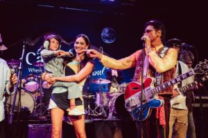 John Stamos Instagram - I thank my beautiful wife who knows how to throw a party - Fake Beatles, @raintribute (the best Beatles band ever!) Real Beach Boys, @mikeloveofficial @jamieleecurtis handing out @stamos bracelets, @glenpowell riding some big cow-like animal, all my friends, family, (party crashers) it was a 60’s party that was better than the actual 60’s ! 📸 @micalaaustin @canyonagoura THANK YOU!