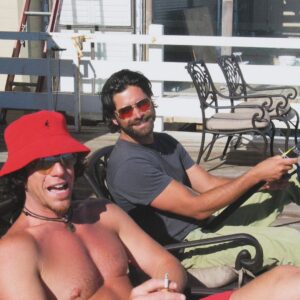 John Stamos Instagram - At the painfully young age of 58, my dear friend, Ralph Cirella, was suddenly taken from us, leaving us all in a state of profound shock. He was, without a doubt, a one-of-a-kind soul. 
Ralph wasn't just a friend; he was family. My mother adored him, and I'll always cherish the memory of her affectionately mistaking his “berry” for a piece of red jello on his upper lip, playfully attempting to wipe it away. 

When met in the old days where he worked his magic as a makeup artist for Howard Stern's Channel 9 show. I can vividly recall how he transformed Howard into a perfect replica of Larry King, showcasing his exceptional talent and creativity. From the day forward, we were life long friends, I just wished he lived longer. 

Ralph possessed an abundance of untapped potential, but he grappled with finding the motivation to fully realize it—a painful reality that we all witnessed. It serves as a poignant reminder of life's unpredictability and the importance of not only pursuing our dreams but also seeing them through to the end.
My heart aches at the thought of Ralph departing this world alone, without ever experiencing the deep love he undeniably deserved. In our final exchange, I shared a story about someone who called me lucky. When I asked why, their response was simple and profound: "Because you're friends with Ralph from the Howard Stern show." And they were absolutely right.
My dear friend, I will miss you so much.  I love you, Ralphie boy. Rest in peace.
HEY NOW XO