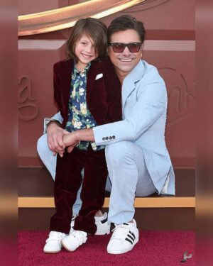 John Stamos Instagram - We got the golden ticket to the premiere of @wonkamovie last night! It was such a treat to bring Billy with us to this one. He was so excited and we all loved the movie. Thanks for having us! Go see #WonkaMovie this weekend 🍫 

@johnphotography
@gilbertfloresphoto
@gettyentertainment