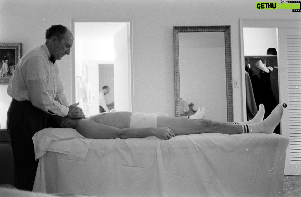 Johnny Knoxville Instagram - Oh man, just came across this photo and can’t stop giggling. It’s a 1965 shot of Frank Sinatra getting a massage in his suite at Miami’s Eden Roc Hotel. So goddamn funny. The BVD’s, skinny legs and the socks. 👏 I sent the photo to my cousin @rogeralanwade and he shot back, “Dang cuz, ol’ Frank’s crotch looks like the plains of Nebraska. He was either tucking it or Ava Gardner was lying like hell.” 📸 by John Dominus for Life Magazine