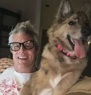 Johnny Knoxville Instagram - I can’t stop taking pictures of me and @bucket.biz. I’m a smidge under the weather so me and her have been curled up on the couch for a few days. I actually have a crick in the back of my neck because she sits on it like a cat. But she’s so cute I can’t tell her to get down. ❤️ Well that’s not entirely true as she has tooted on my shoulder a couple of times(see pic) and we do re-situate in those instances. 🙊